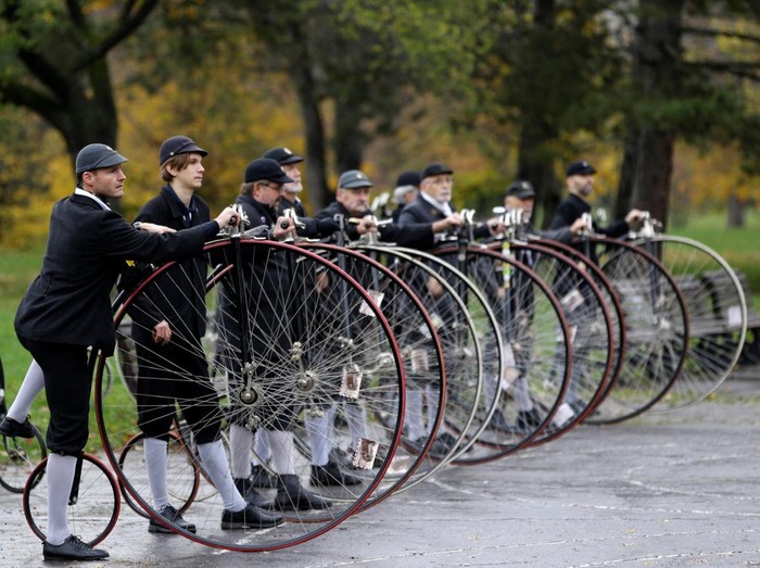 Participants wearing historical costumes ride their high-wheel bicycles during the annual penny farthing race in Prague, Czech Republic, November 5, 2022. REUTERS/David W Cerny