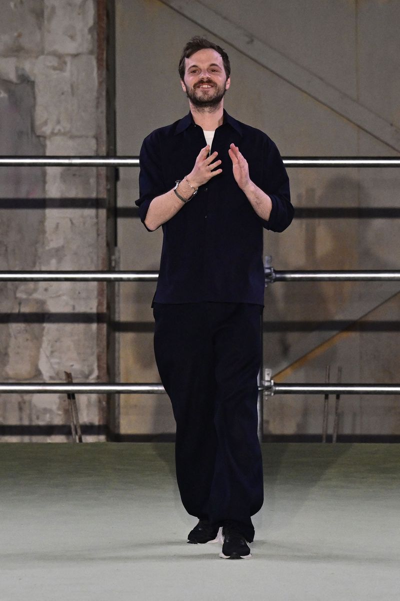French fashion designer Matthieu Blazy acknowledges the audience at the end of the Bottega Veneta Women catwalk show for the Fall/Winter 2022/2023 on the fifth day of the Milan Fashion Week in Milan on February 26, 2022. (Photo by Miguel MEDINA / AFP) (Photo by MIGUEL MEDINA/AFP via Getty Images)