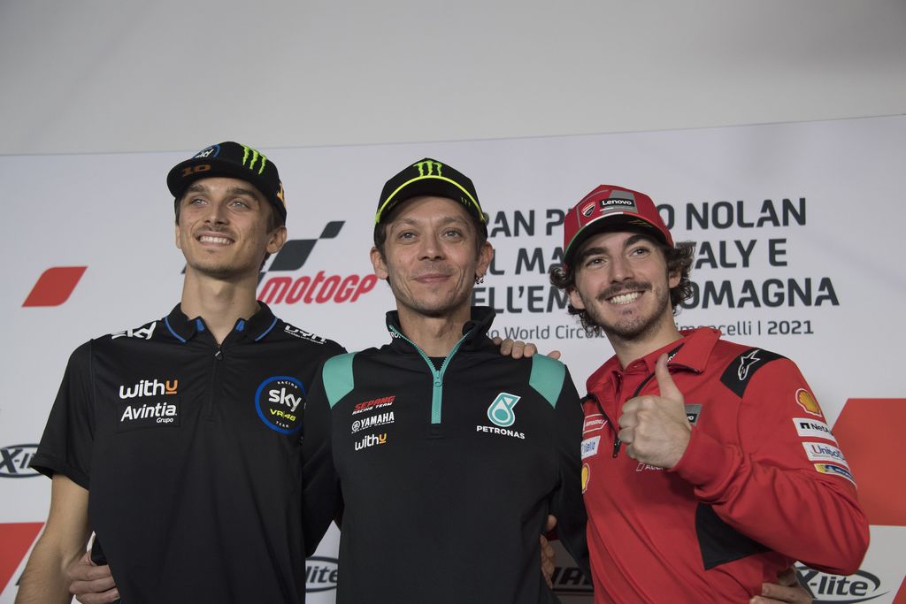 MISANO ADRIATICO, ITALY - OCTOBER 21: (L-R)  Luca Marini of Italy and SKY VR46 Esponsorama, Valentino Rossi of Italy and Petronas Yamaha SRT  and  Francesco Bagnaia of Italy and Ducati Lenovo Team  pose during the Pre-Event Press Conference during the MotoGP of Emilia Romagna - Previews at Misano World Circuit on October 21, 2021 in Misano Adriatico, Italy. (Photo by Mirco Lazzari gp/Getty Images)