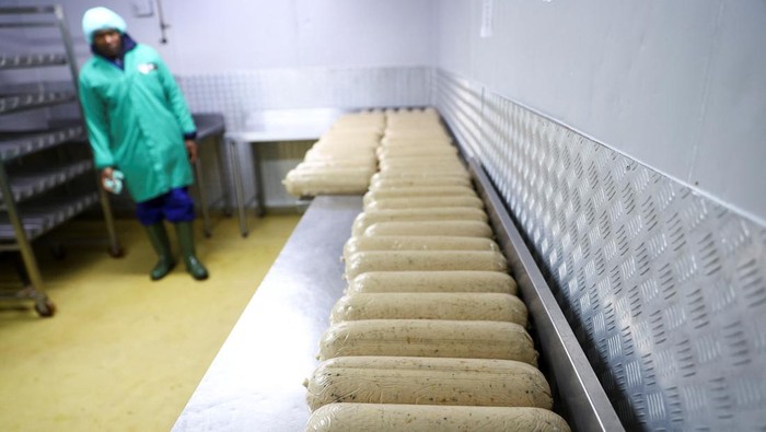 Workers prepare a plant-based polony used as an alternative or meat substitute at meat processor Feinschmecker, in Germiston, in the East Rand region of Johannesburg, South Africa, October 11, 2022. REUTERS/Siphiwe Sibeko