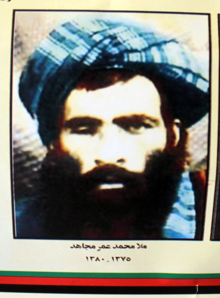 This picture taken in Kandahar on July 31, 2015 shows a calender bearing the image of the Afghan Taliban's deceased leader Mullah Omar.  The Taliban named Mullah Akhtar Mansour as their new leader July 31, a historic power transition that raises hopes the relative moderate's leadership will pave the way for an end to Afghanistan's bloody war.  AFP PHOTO / Javed Tanveer        (Photo credit should read JAVED TANVEER/AFP via Getty Images)