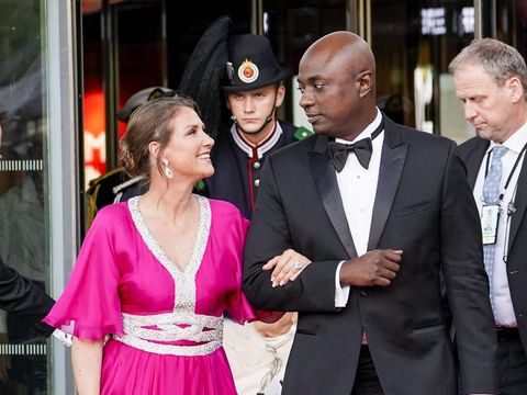 Princess Martha-Louise of Norway (L) and her fiancé self-professed shaman Durek Verrett (2nd R) arrive at the government's party celebratation of Norway's Princess' 18th birthday at Deichman Bjoervika, Oslo's main library, in Oslo, Norway, on June 16, 2022, months after her actual birthday. - A princess who speaks to angels and a self-proclaimed shaman who sells pricey medallions he claims save lives: the unusual couple are madly in love but struggling to win hearts in Norway. Martha Louise, the divorced 51-year-old daughter of Norway's king and queen, has rebuilt her life with Durek Verrett, a popular Hollywood spiritual guru four years her junior. The princess and Shaman Durek, as he is known, announced their engagement in June, with King Harald's blessing. (LISE ASERUD/NTB/AFP via Getty Images)