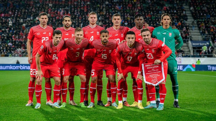 Switzerlands players (L to R) second row: defender Fabian Schär, defender Ricardo Rodriguez, defender Nico Elvedi, midfielder Granit Xhaka, forward Breel Embolo and goalkeeper Yann Sommer. Front row: midfielder Remo Freuler, defender Silvan Widmer, midfielder Djibril Sow, midfielder Ruben Vargas and midfielder Xherdan Shaqiri pose for a picture prior to the UEFA Nations League League A - Group 2 football match Switzerland versus Czech Republic at Kybunpark stadium in St. Gallen on September 27, 2022. (Photo by Fabrice COFFRINI / AFP) (Photo by FABRICE COFFRINI/AFP via Getty Images)