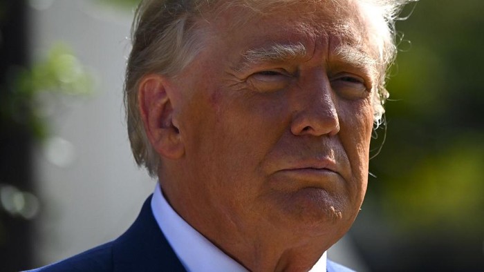 Former US President Donald Trump speaks to the media while departing a polling station after voting in the US midterm elections at Morton and Barbara Mandel Recreation Center in Palm Beach, Florida, on November 8, 2022. (Photo by Eva Marie UZCATEGUI / AFP)