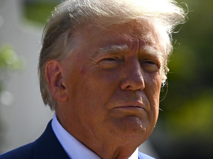 Former US President Donald Trump speaks to the media while departing a polling station after voting in the US midterm elections at Morton and Barbara Mandel Recreation Center in Palm Beach, Florida, on November 8, 2022. (Photo by Eva Marie UZCATEGUI / AFP)