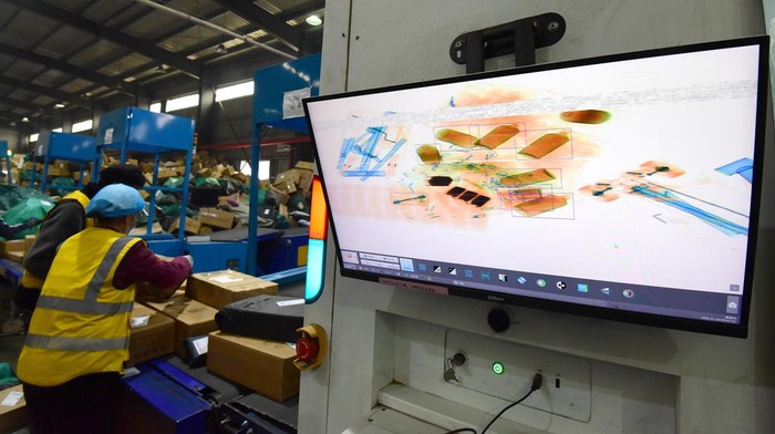HANDAN, CHINA - NOVEMBER 10, 2022 - Staff members work at the Network operation center of the Delivery Division of Handan Branch of China Post Group Co LTD in Handan, Hebei province, China, Nov 10, 2022. (Photo credit should read CFOTO/Future Publishing via Getty Images)