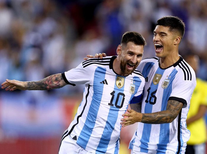 HARRISON, NEW JERSEY - SEPTEMBER 27:  Lionel Messi #10 of Argentina celebrates his goal with teammate Joaquin Correa #16 in the second half against Jamaica at Red Bull Arena on September 27, 2022 in Harrison, New Jersey. Argentina defeated Jamaica 3-0. (Photo by Elsa/Getty Images)