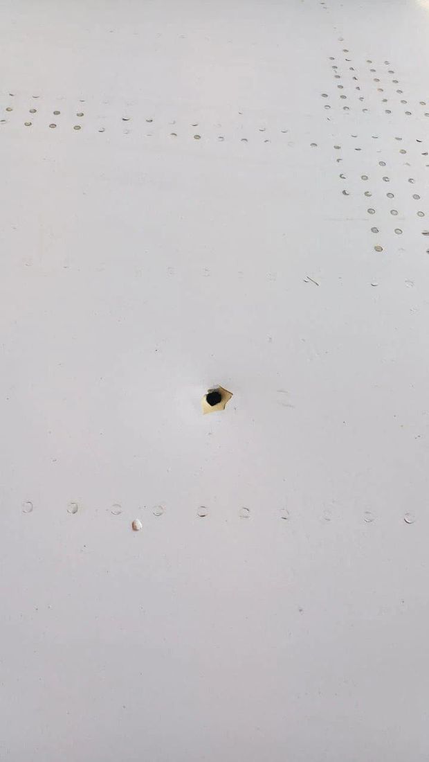 A bullet hole is seen in the fuselage of a Middle East Airlines (MEA) passenger plane, after it was hit by a stray bullet while landing in Beirut, with no injuries reported, according to MEA Chairman Mohamad El-Hout, Lebanon November 10, 2022. Middle East Airlines/Handout via Reuters