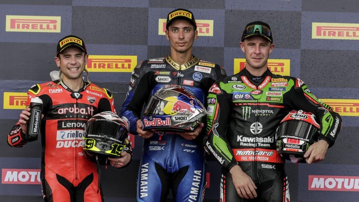 LOMBOK, INDONESIA - NOVEMBER 12: Turkish superbike rider Toprak Razgatlioglu of Yamaha Pata With Brixx (middle), British rider Jonathan Rea of Kawasaki Racing Team (right) and Spanish rider Alvaro Bautista of Aruba.it (left) pose for photograph after Race 1 of Pirelli Indonesian Round - World Superbike Championship at Pertamina Mandalika International Circuit in Lombok, Indonesia on November 12, 2022. Toprak Razgatlioglu finish first followed by Alvaro Bautista and Jonathan Rea. (Photo by Johannes P. Christo/Anadolu Agency via Getty Images)
