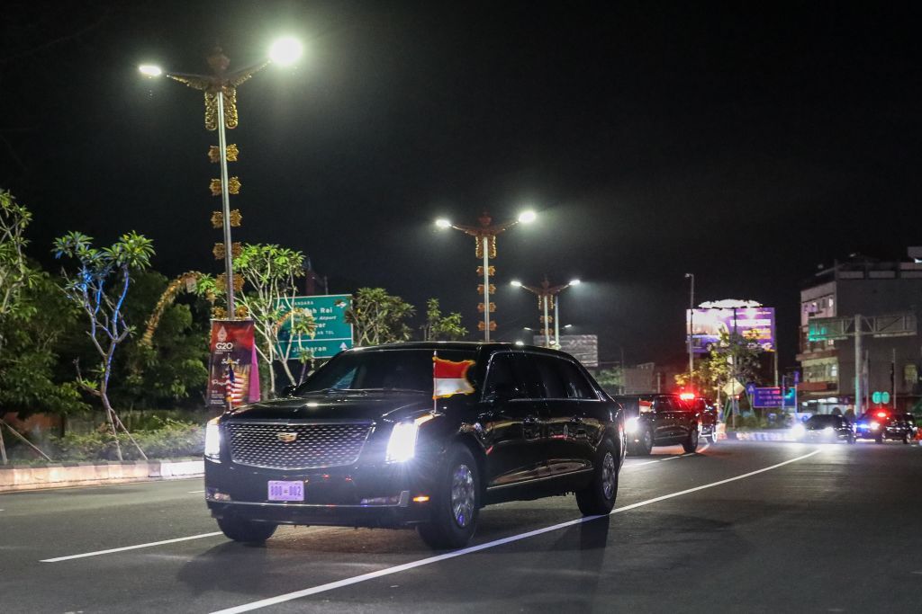 Cars transporting U.S. President Joe Biden's convoy drives along a road after Biden arrived at Ngurah Rai International Airport ahead of the G20 Summit in Nusa Dua, Bali, Indonesia, Sunday, Nov. 13, 2022. Indonesia will host the 17th G20 Summit in Nusa Dua, Bali, Nov. 15-16. The heads of state from 19 countries and the European Union (EU) are scheduled to attend the summit. Other related events will occur from Nov. 10. Around 6,500 delegates are also expected to participate in the summit. The main meeting will take place at Apurva Kempinski, while other event venues include Garuda Wisnu Kencana (GWK) Cultural Park in South Kuta, Ngurah Rai Mangrove Forest in Denpasar, and Hotel Sofitel Bali Nusa Dua. (Photo by Garry Lotulung/NurPhoto via Getty Images)