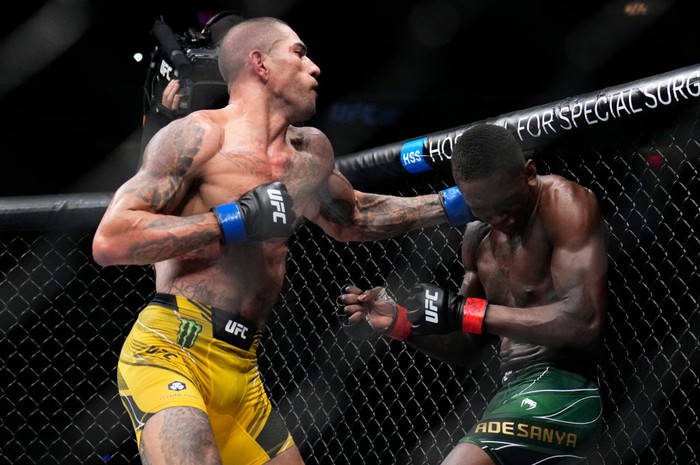 NEW YORK, NEW YORK - NOVEMBER 12: (L-R) Alex Pereira of Brazil punches Israel Adesanya of Nigeria in the UFC middleweight championship bout during the UFC 281 event at Madison Square Garden on November 12, 2022 in New York City. (Photo by Chris Unger/Zuffa LLC)