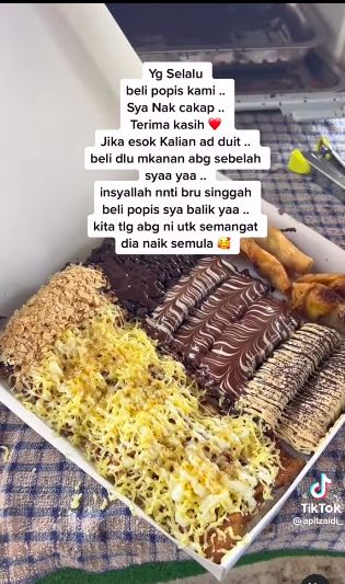 Penjual makanan promosikan dagangan orang lain