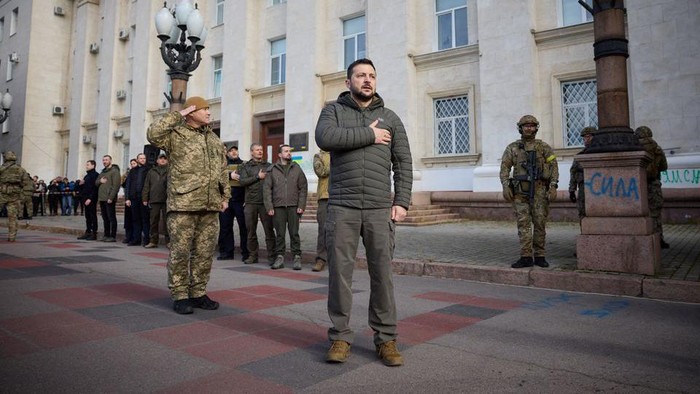 Ukraines President Volodymyr Zelenskiy sings the national anthem during his visit in Kherson, Ukraine November 14, 2022. Ukrainian Presidential Press Service/Handout via REUTERS