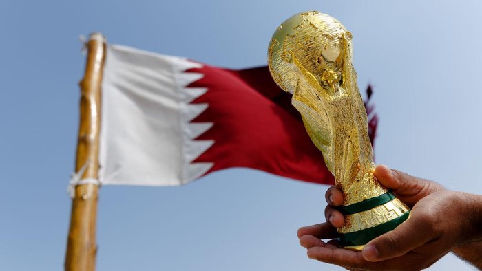 DOHA, QATAR - NOVEMBER 14: Images of Gareth Bale of Wales, Hassan Al-Haydos of Qatar and the FIFA World Cup trophy are seen on sky scrapers in the West Bay area ahead of the FIFA World Cup Qatar 2022 on November 14, 2022 in Doha, Qatar. (Photo by Catherine Ivill/Getty Images)