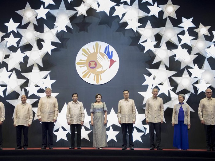 Philippine President Rodrigo Duterte (4th L) and his partner Honeylet Avancena (C) pose for a family photo with US President Donald Trump (3rd L) and other leaders during a special gala celebration dinner for the Association of Southeast Asian Nations (ASEAN) in Manila on November 12, 2017. 
Trump arrived in the Philippine capital for regional summits, the last leg of a marathon Asian tour, according to an AFP reporter travelling with him. / AFP PHOTO / JIM WATSON        (Photo credit should read JIM WATSON/AFP via Getty Images)