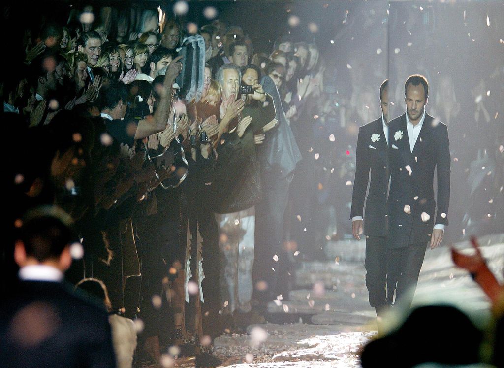 MILAN, ITALY:  US designer Tom Ford leaves the catwalk at the end of his last Gucci Autumn/Winter 2004-2005 women' collection as part of Milan fashion week 25 February 2004.    AFP PHOTO /Patrick HERTZOG  (Photo credit should read PATRICK HERTZOG/AFP via Getty Images)