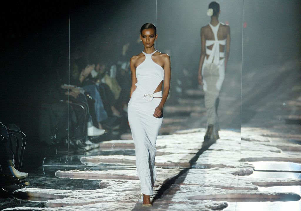 MILAN, ITALY:  A model wears a creation as part of US designer Tom Ford's last show for Gucci during the Autumn/Winter 2004-2005 collections presentation at Milan fashion week 25 February 2004.       AFP PHOTO / Patrick HERTZOG  (Photo credit should read PATRICK HERTZOG/AFP via Getty Images)