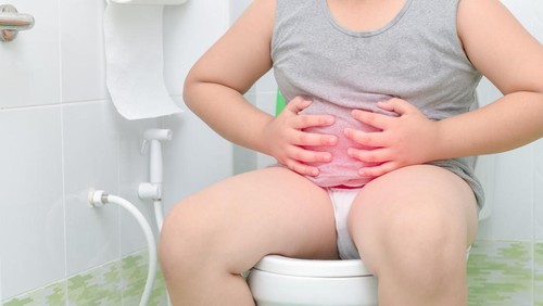 fat boy suffer stomach and sit in toilet, diarrhea constipation and health concept