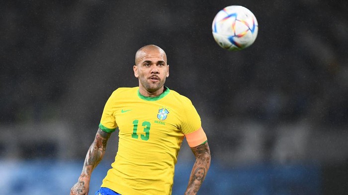 Brazils Dani Alves runs with the ball during the friendly football match between Japan and Brazil at the National Stadium in Tokyo on June 6, 2022. (Photo by Charly TRIBALLEAU / AFP) (Photo by CHARLY TRIBALLEAU/AFP via Getty Images)