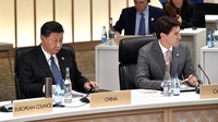 Momen PM Kanada Justin Trudeau dan Presiden China Xi Jinping duduk bersebelahan di KTT G20 Osaka Jepang pada 29 Juni 2019. Kazuhiro Nogi-Pool/Getty Images.