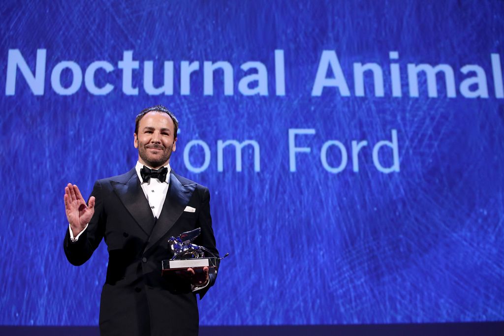 VENICE, ITALY - SEPTEMBER 10: Director Tom Ford receives the silver Lion for his movie 'Nocturnal Animal' during  the closing ceremony of the 73rd Venice Film Festival at Sala Grande on September 10, 2016 in Venice, Italy.  (Photo by Franco Origlia/Getty Images)