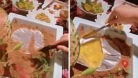 Tak ingin pelanggannya makan dengan mudah, restoran ini menantang para pelanggan untuk berusaha mendapatkan makanan mereka. Semangkuk sup disajikan dengan cara ditimbun pada bak pasir. Foto: Bored Panda