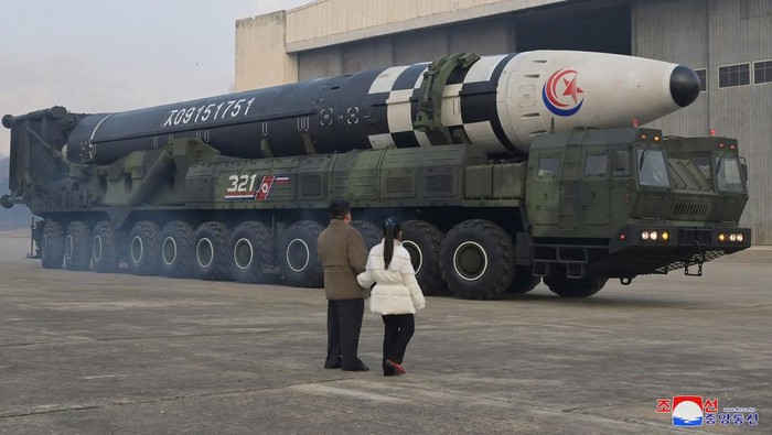 North Korean leader Kim Jong Un, along with his daughter, inspects an intercontinental ballistic missile (ICBM) in this undated photo released on November 19, 2022 by North Koreas Korean Central News Agency (KCNA). KCNA via REUTERS ATTENTION EDITORS - THIS IMAGE WAS PROVIDED BY A THIRD PARTY. NO THIRD PARTY SALES. SOUTH KOREA OUT. NO COMMERCIAL OR EDITORIAL SALES IN SOUTH KOREA. REUTERS IS UNABLE TO INDEPENDENTLY VERIFY THIS IMAGE