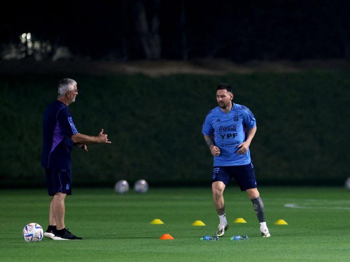 DOHA, QATAR - NOVEMBER 19: Lionel Messi of Argentina trains away from the main squad with the medical adviser during the training session for Team Argentina at Qatar University on November 19, 2022 in Doha, Qatar. (Photo by Dean Mouhtaropoulos/Getty Images)