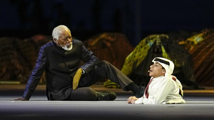 US actor Morgan Freeman, left, sits on the stage next to FIFA World Cup Ambassador Ghanim Al Muftah, at the opening ceremony prior he World Cup, group A soccer match between Qatar and Ecuador at the Al Bayt Stadium in Al Khor, Sunday, Nov. 20, 2022. (AP Photo/Natacha Pisarenko)
