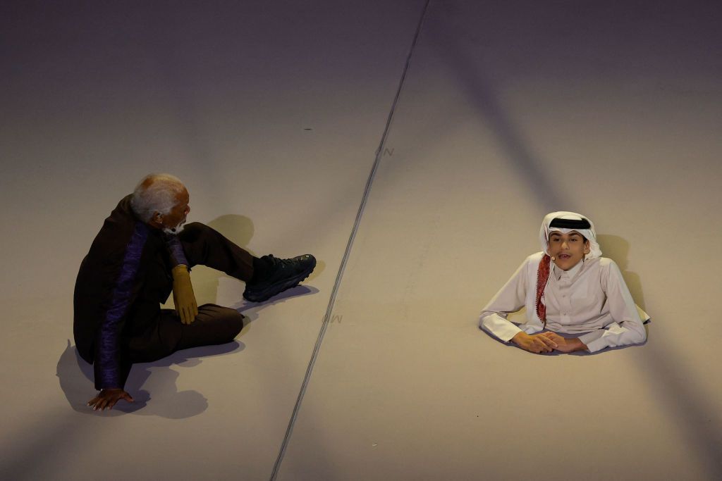 US actor Morgan Freeman (L) and Qatari YouTuber Ghanim al Muftah speak during the opening ceremony ahead of the Qatar 2022 World Cup Group A football match between Qatar and Ecuador at the Al-Bayt Stadium in Al Khor, north of Doha on November 20, 2022. (Photo by Odd ANDERSEN / AFP) (Photo by ODD ANDERSEN/AFP via Getty Images)