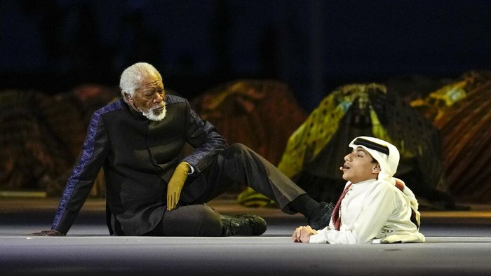US actor Morgan Freeman, left, sits on the stage next to FIFA World Cup Ambassador Ghanim Al Muftah, at the opening ceremony prior he World Cup, group A soccer match between Qatar and Ecuador at the Al Bayt Stadium in Al Khor, Sunday, Nov. 20, 2022. (AP Photo/Natacha Pisarenko)