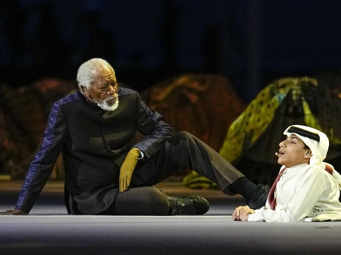 US actor Morgan Freeman, left, sits on the stage next to FIFA World Cup Ambassador Ghanim Al Muftah, at the opening ceremony prior he World Cup, group A soccer match between Qatar and Ecuador at the Al Bayt Stadium in Al Khor, Sunday, Nov. 20, 2022. (AP Photo/Natacha Pisarenko)