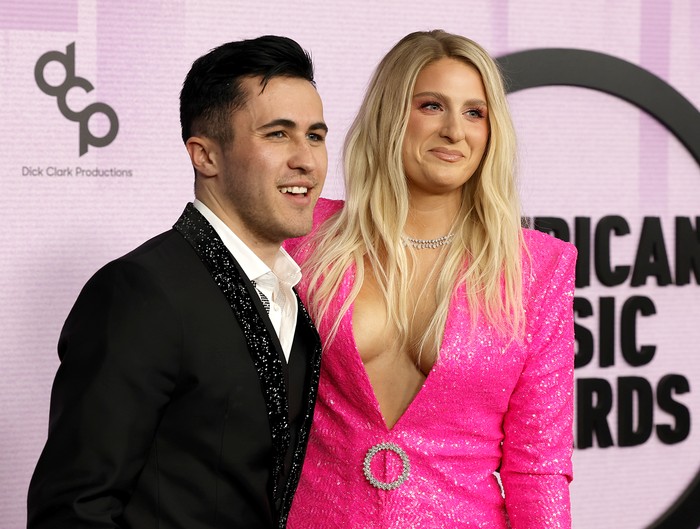 LOS ANGELES, CALIFORNIA - NOVEMBER 20: (EDITORIAL USE ONLY) (L-R) Chris Olsen and Meghan Trainor attend the 2022 American Music Awards at Microsoft Theater on November 20, 2022 in Los Angeles, California. (Photo by Frazer Harrison/Getty Images)