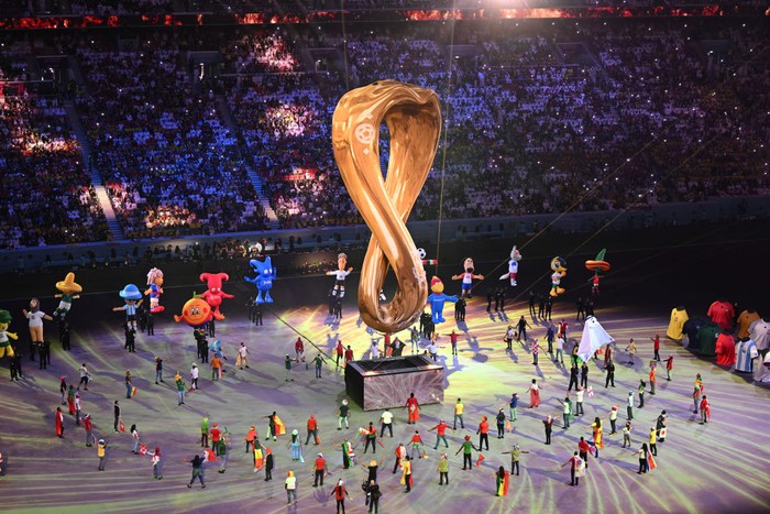 dpatop - 20 November 2022, Qatar, Al-Chaur: Soccer, World Cup 2022 in Qatar, Qatar - Ecuador, preliminary round, group A, match day 1, opening match at Al-Bait Stadium, artists dance during the opening ceremony. Photo: Robert Michael/dpa (Photo by Robert Michael/picture alliance via Getty Images)