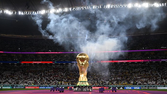 A replica of the FIFA World Cup trophy is pictured on the pitch during the opening ceremony ahead of the Qatar 2022 World Cup Group A football match between Qatar and Ecuador at the Al-Bayt Stadium in Al Khor, north of Doha on November 20, 2022. (Photo by Raul ARBOLEDA / AFP) (Photo by RAUL ARBOLEDA/AFP via Getty Images)