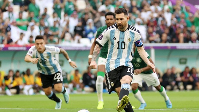 LUSAIL CITY, QATAR - NOVEMBER 22: Lionel Messi of Argentina scores their teams first goal via a penalty during the FIFA World Cup Qatar 2022 Group C match between Argentina and Saudi Arabia at Lusail Stadium on November 22, 2022 in Lusail City, Qatar. (Photo by Catherine Ivill/Getty Images)