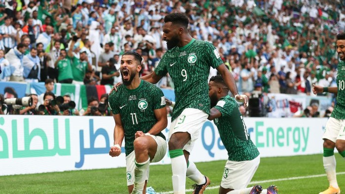 LUSAIL CITY, QATAR - NOVEMBER 22: Saleh Al-Shehri of Saudi Arabia celebrates with his team mates after scoring a goal to make it 1-1 during the FIFA World Cup Qatar 2022 Group C match between Argentina and Saudi Arabia at Lusail Stadium on November 22, 2022 in Lusail City, Qatar. (Photo by James Williamson - AMA/Getty Images)