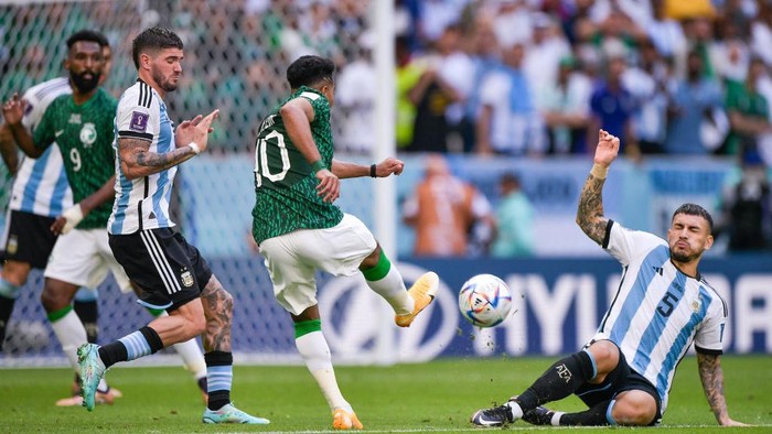LUSAIL CITY, QATAR - NOVEMBER 22: Saleh Al-Shehri of Saudi Arabia celebrates with his team mates after scoring a goal to make it 1-1 during the FIFA World Cup Qatar 2022 Group C match between Argentina and Saudi Arabia at Lusail Stadium on November 22, 2022 in Lusail City, Qatar. (Photo by James Williamson - AMA/Getty Images)