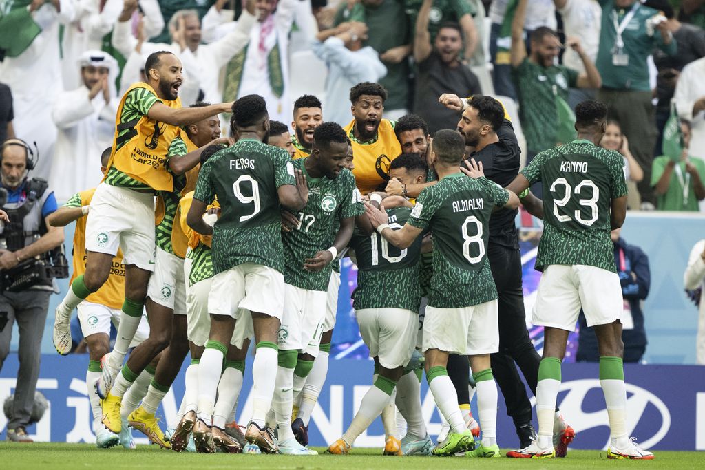 LUSAIL CITY, QATAR - NOVEMBER 22: Saudi Arabia players celebrate their second goal to make the score 1-2 during the FIFA World Cup Qatar 2022 Group C match between Argentina and Saudi Arabia at Lusail Stadium on November 22, 2022 in Lusail City, Qatar. (Photo by Sebastian Frej/MB Media/Getty Images)