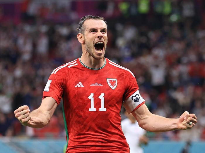 DOHA, QATAR - NOVEMBER 21: Gareth Bale of Wales celebrates after scoring their 1st goal during the FIFA World Cup Qatar 2022 Group B match between USA and Wales at Ahmad Bin Ali Stadium on November 21, 2022 in Doha, Qatar. (Photo by Simon Stacpoole/Offside/Offside via Getty Images)