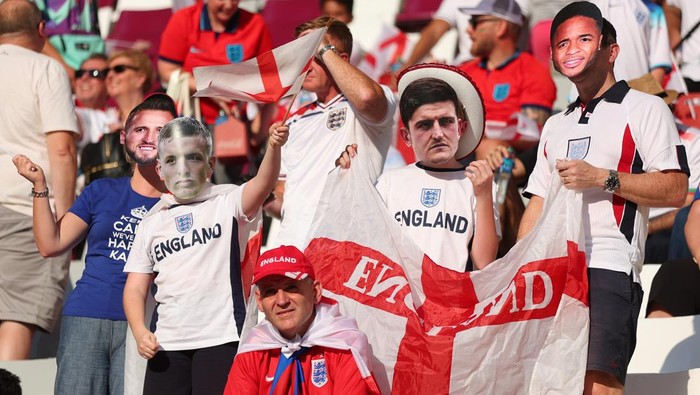 DOHA, QATAR - NOVEMBER 21: England fans wearing player masks enjoy the pre-match atmosphere prior to the FIFA World Cup Qatar 2022 Group B match between England and IR Iran at Khalifa International Stadium on November 21, 2022 in Doha, Qatar. (Photo by Marc Atkins/Getty Images)