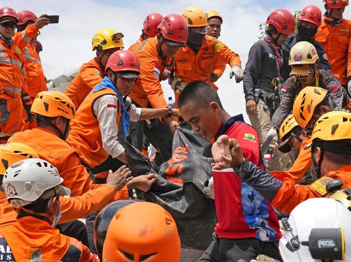 Rescuers use equipment to break through cement as they try to recover the body of an earthquake victim from under the rubble of a collapsed building in Cianjur, West Java, Indonesia,Tuesday, Nov. 22, 2022. Rescuers on Tuesday struggled to find more bodies from the rubble of homes and buildings toppled by an earthquake that killed a number of people and injured hundreds on Indonesias main island of Java. (AP Photo/Tatan Syuflana)