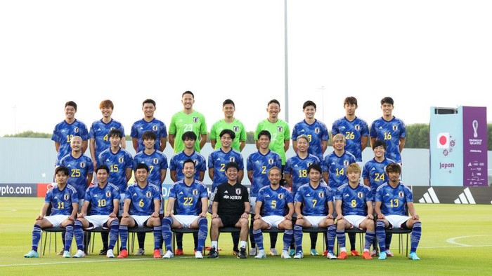 DOHA, QATAR - NOVEMBER 19: Players and coach of Japan attend the team group photo call during Japan Training and Press Conference at Al Sadd SC New Training Facilities 1  on November 19, 2022 in Doha, Qatar. (Photo by Zhizhao Wu/Getty Images)