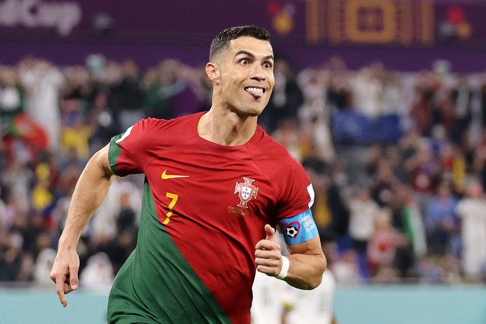DOHA, QATAR - NOVEMBER 24: Cristiano Ronaldo of Portugal celebrates after scoring their teams first goal via a penalty during the FIFA World Cup Qatar 2022 Group H match between Portugal and Ghana at Stadium 974 on November 24, 2022 in Doha, Qatar. (Photo by Clive Brunskill/Getty Images)