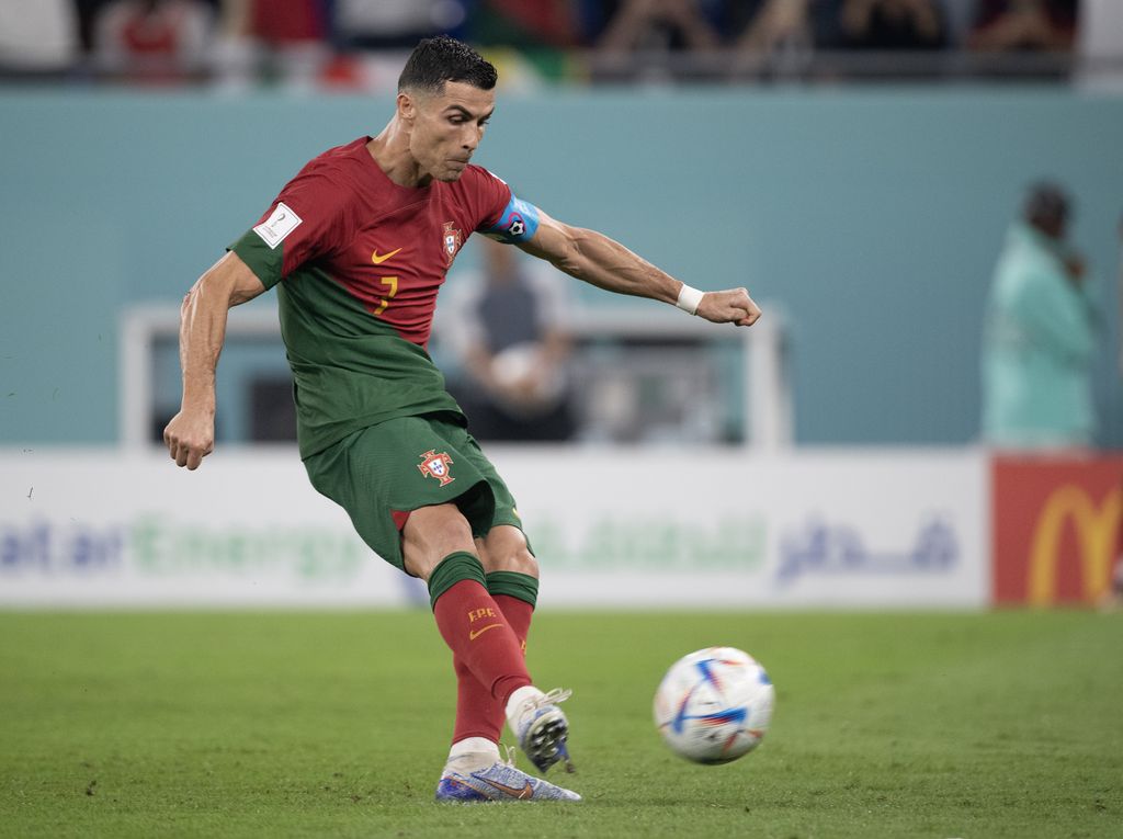 DOHA, QATAR - NOVEMBER 24:  Cristiano Ronaldo scores from the penalty spot for Portugal during the FIFA World Cup Qatar 2022 Group H match between Portugal and Ghana at Stadium 974 on November 24, 2022 in Doha, Qatar. (Photo by Visionhaus//Getty Images)