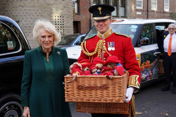 LONDON, ENGLAND - NOVEMBER 24: Camilla, Queen Consort departs Barnardo’s Nursery, Bow on November 24, 2022 in London, England. Camilla, Queen Consort will personally deliver Paddington bears and other cuddly toys that were left as tributes to Queen Elizabeth II at Royal Residences to children supported by Barnardos. (Photo by Karwai Tang/WireImage)