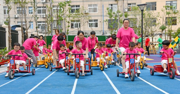 XIANJU, CHINA - OCTOBER 08: Children ride tricycles at a kindergarten on October 8, 2021 in Xianju County, Taizhou City, Zhejiang Province of China. (Photo by Wang Huabin/VCG via Getty Images)