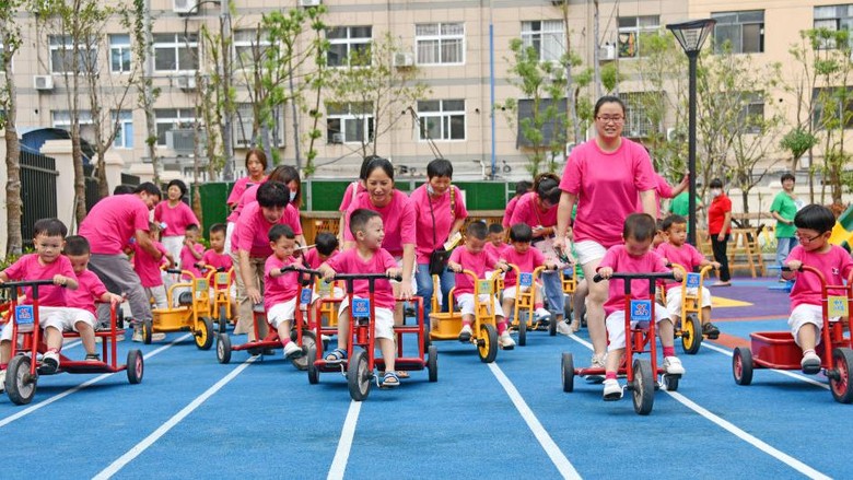 XIANJU, CHINA - OCTOBER 08: Children ride tricycles at a kindergarten on October 8, 2021 in Xianju County, Taizhou City, Zhejiang Province of China. (Photo by Wang Huabin/VCG via Getty Images)