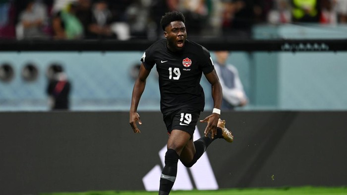 DOHA, QATAR - NOVEMBER 27: Alphonso Davies of Canada celebrates after scoring their teams first goal during the FIFA World Cup Qatar 2022 Group F match between Croatia and Canada at Khalifa International Stadium on November 27, 2022 in Doha, Qatar. (Photo by David Ramos - FIFA/FIFA via Getty Images)