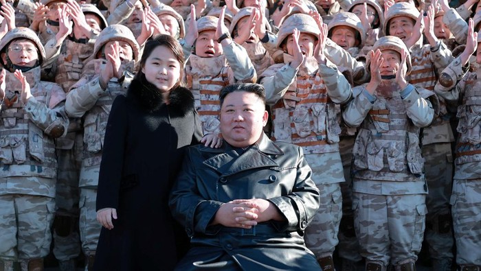 North Korean leader Kim Jong Un and his daughter attend a photo session with the scientists, engineers, military officials and others involved in the test-fire of the country's new Hwasong-17 intercontinental ballistic missile (ICBM) in this undated photo released on November 27, 2022 by North Korea's Korean Central News Agency (KCNA) KCNA via REUTERS ATTENTION EDITORS - THIS IMAGE WAS PROVIDED BY A THIRD PARTY. REUTERS IS UNABLE TO INDEPENDENTLY VERIFY THIS IMAGE. NO THIRD PARTY SALES. SOUTH KOREA OUT. NO COMMERCIAL OR EDITORIAL SALES IN SOUTH KOREA.